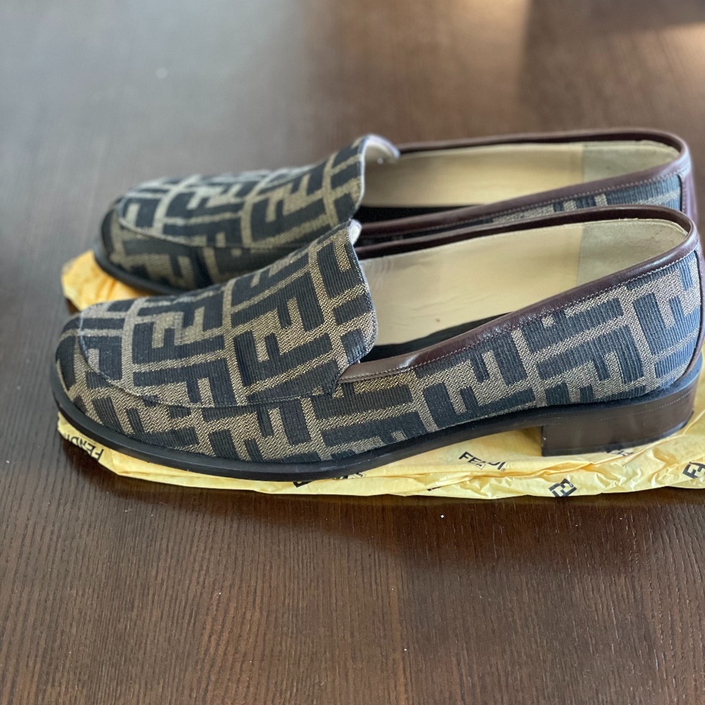 FENDI Zucca flat loafers in black and sand.